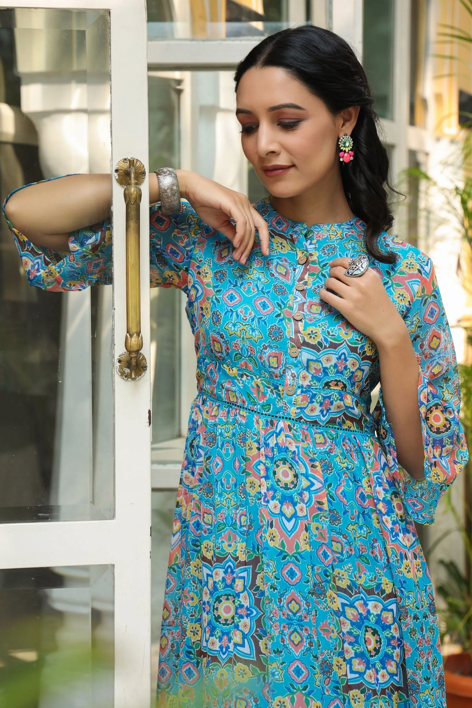 Jashvi Aqua Blue Geometric Printed Chiffon Tiered Maxi Dress With Buttons.